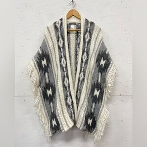 Elsamanda Fringed and Knitted Wool/Acrylic Poncho with Geometric Patterns, S/M
